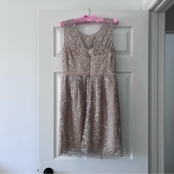 Stand out at holiday parties wearing this elegant Jenny Yoo cocktail dress. - Picture 2 of 3